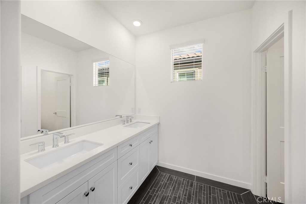 2323 Apple Upland, CA 91786 - Photo 26 of 57 a bathroom with a sink and a mirror