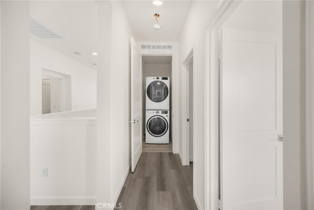 2323 Apple Upland, CA 91786 - Photo 30 of 57 a view of a hallway with wooden floor washer and dryer