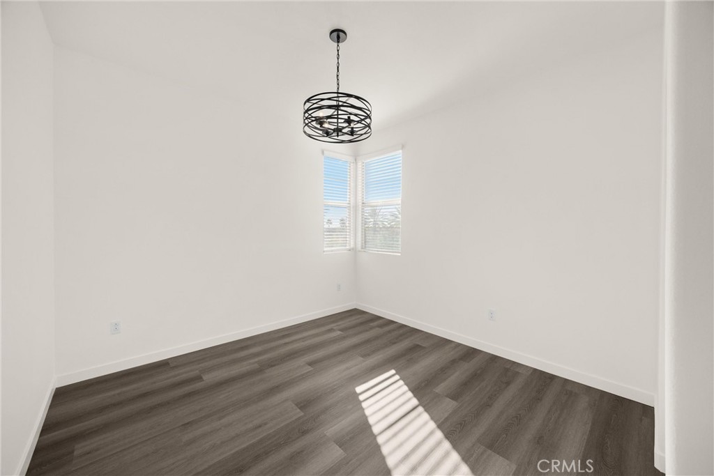 2323 Apple Upland, CA 91786 - Photo 32 of 57 a view of an empty room with wooden floor and window