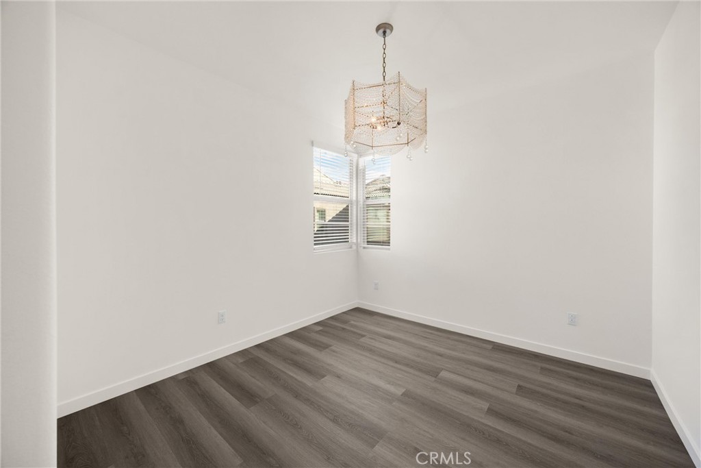 2323 Apple Upland, CA 91786 - Photo 33 of 57 an empty room with wooden floor and windows