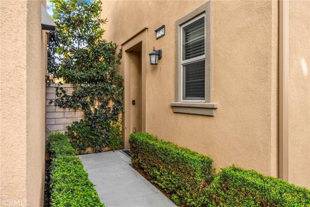 2323 Apple Upland, CA 91786 - Photo 6 of 57 a front view of a house with a yard