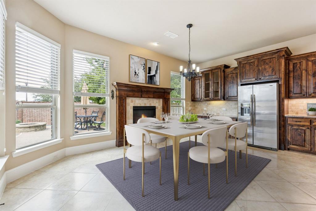 6579 Mountain Sky Road Frisco, TX 75036 - Photo 14 of 40 a view of a dining room with furniture window and wooden floor