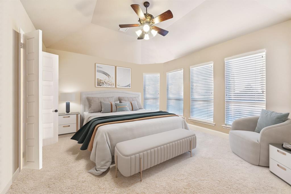 6579 Mountain Sky Road Frisco, TX 75036 - Photo 16 of 40 a spacious bedroom with a bed and a couch