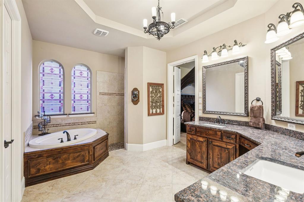 6579 Mountain Sky Road Frisco, TX 75036 - Photo 17 of 40 a spacious bathroom with a tub sink and mirror