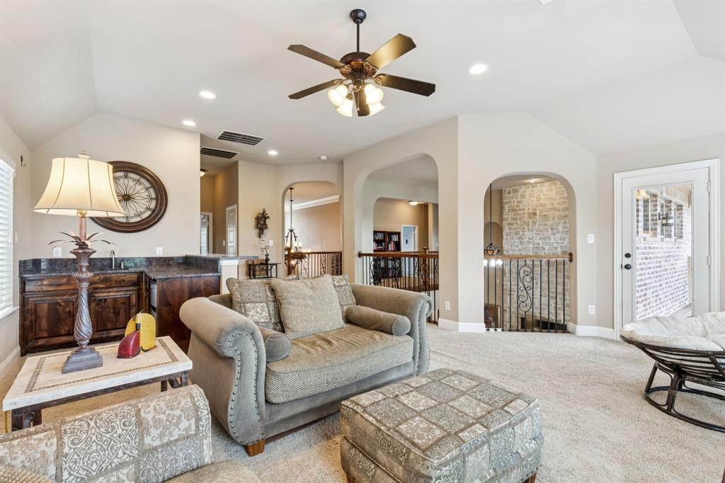 6579 Mountain Sky Road Frisco, TX 75036 - Photo 21 of 40 a living room with furniture and a large window