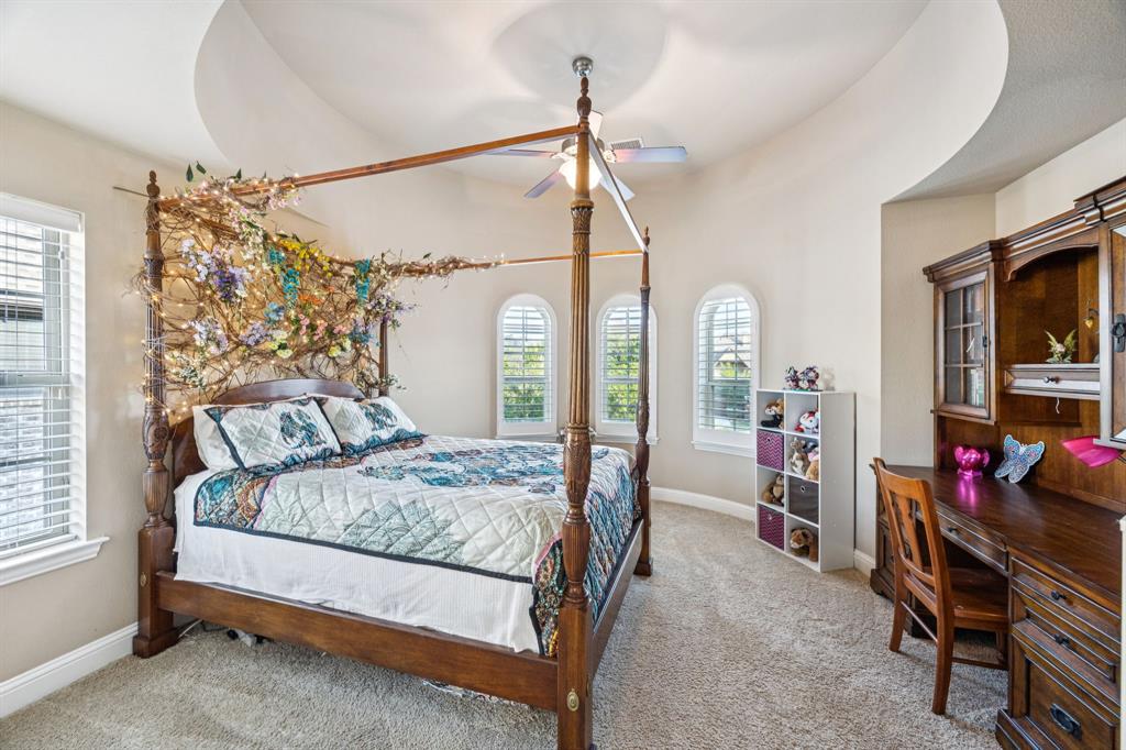 6579 Mountain Sky Road Frisco, TX 75036 - Photo 23 of 40 a bedroom with a bed a flat screen tv and a window