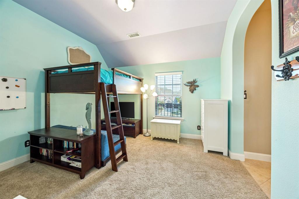 6579 Mountain Sky Road Frisco, TX 75036 - Photo 25 of 40 a room with furniture and a flat screen tv