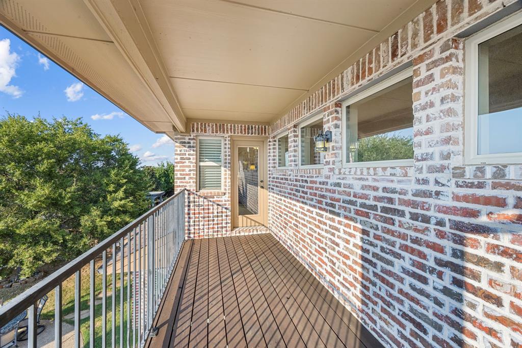 6579 Mountain Sky Road Frisco, TX 75036 - Photo 33 of 40 a view of a balcony with wooden floor and fence