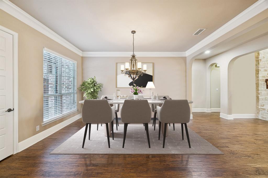 6579 Mountain Sky Road Frisco, TX 75036 - Photo 5 of 40 a dining room with furniture a chandelier and wooden floor