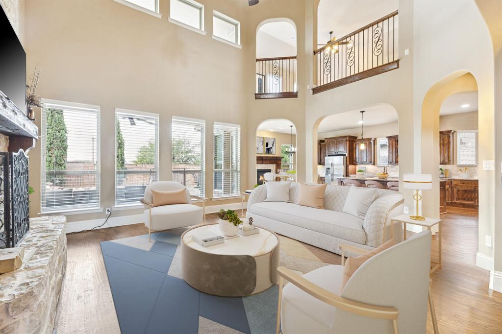 6579 Mountain Sky Road Frisco, TX 75036 - Photo 7 of 40 a living room with fireplace furniture and a large window