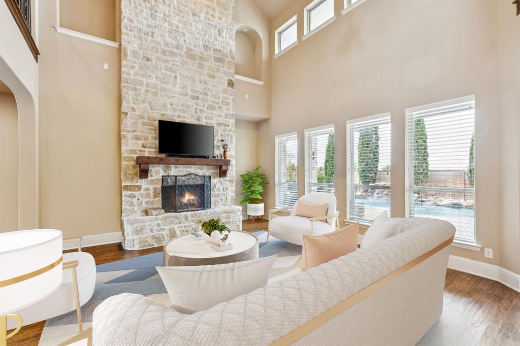6579 Mountain Sky Road Frisco, TX 75036 - Photo 10 of 40 a living room with fireplace furniture and a fireplace