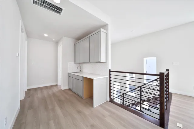 a view of washer and dryer with wooden floor