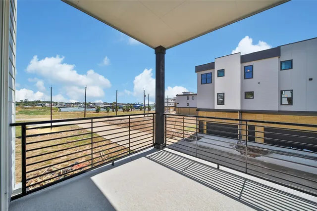 a view of a balcony with car parked
