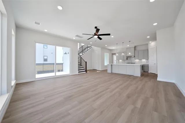 a view of kitchen with refrigerator and window