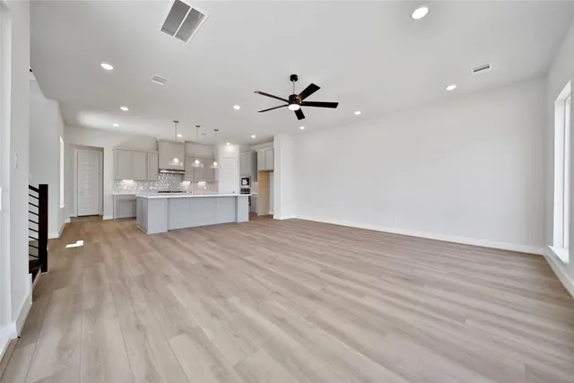 a view of a kitchen with a sink and a stove