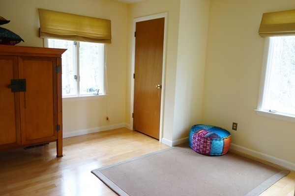 55 High Point Drive Amherst, MA 01002 - Photo 14 of 30 a view of an empty room with wooden floor and a window