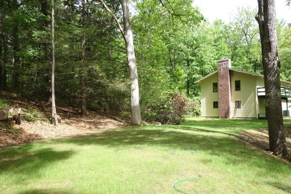55 High Point Drive Amherst, MA 01002 - Photo 26 of 30 a view of a house with backyard and trees