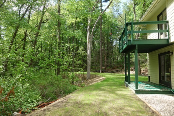55 High Point Drive Amherst, MA 01002 - Photo 28 of 30 a view of a backyard with a small cabin