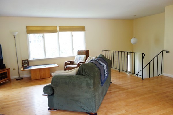 55 High Point Drive Amherst, MA 01002 - Photo 5 of 30 a living room with a bed furniture and a window