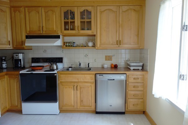 55 High Point Drive Amherst, MA 01002 - Photo 8 of 30 a kitchen with stainless steel appliances granite countertop a stove and a refrigerator
