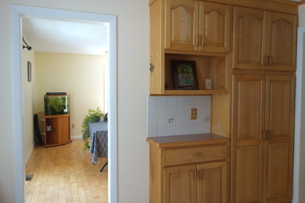 55 High Point Drive Amherst, MA 01002 - Photo 10 of 30 a view of a hallway with wooden floor and a cabinet