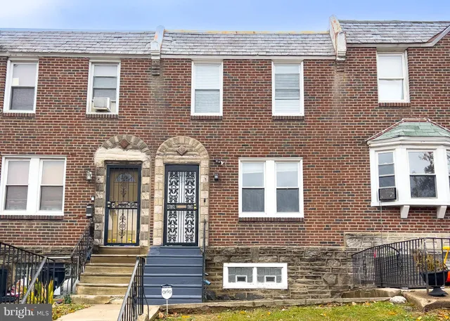 a front view of a house with glass windows