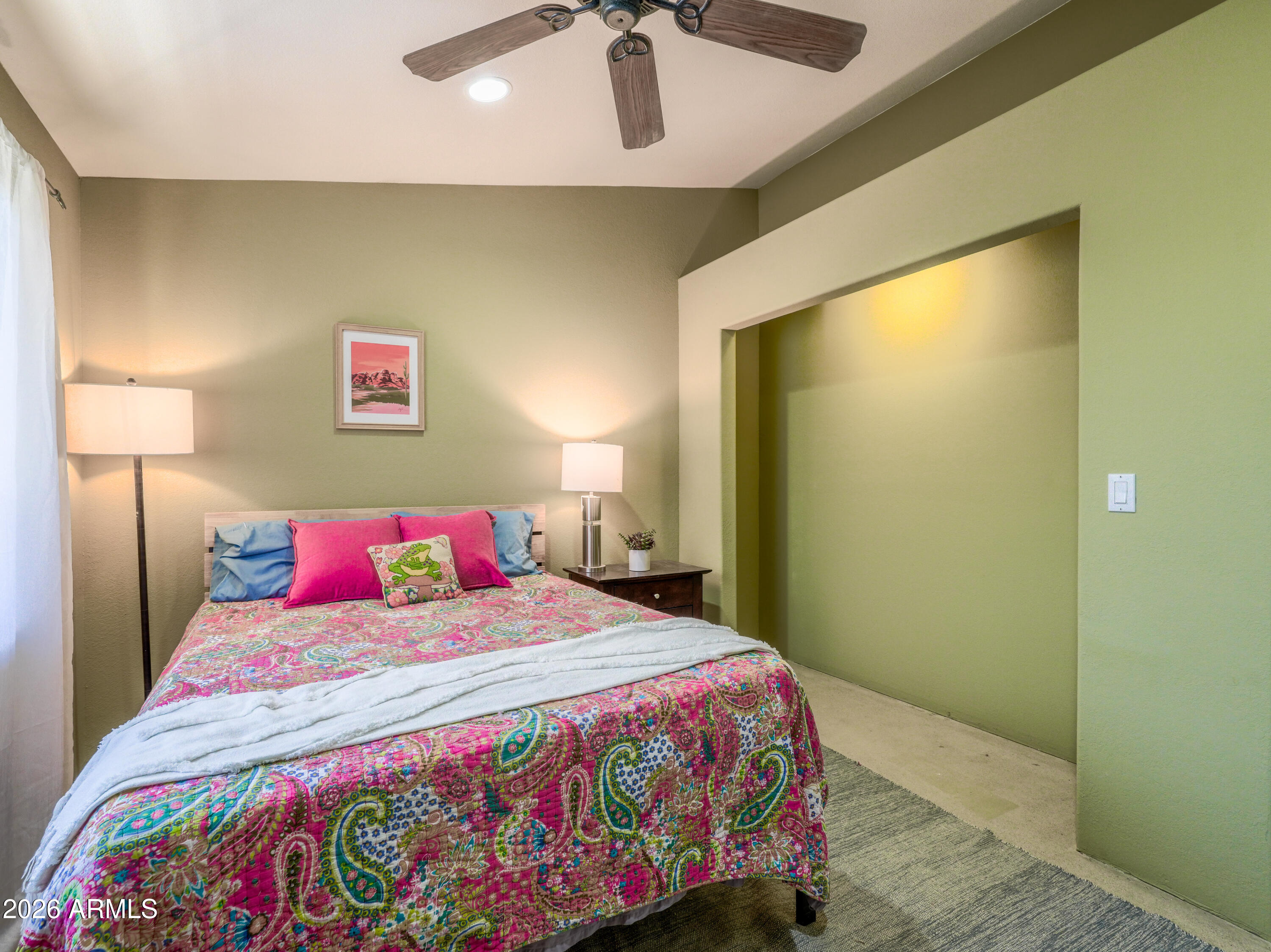 1224 North Acacia Road Apache Junction, AZ 85119 - Photo 29 of 48 a bedroom with a bed and painting on the wall