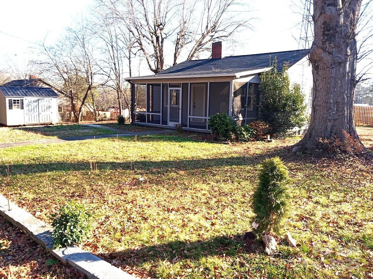 170 Proctor School Road Mooresboro, NC 28114 - Photo 1 of 32 a view of a house with swimming pool and a garden