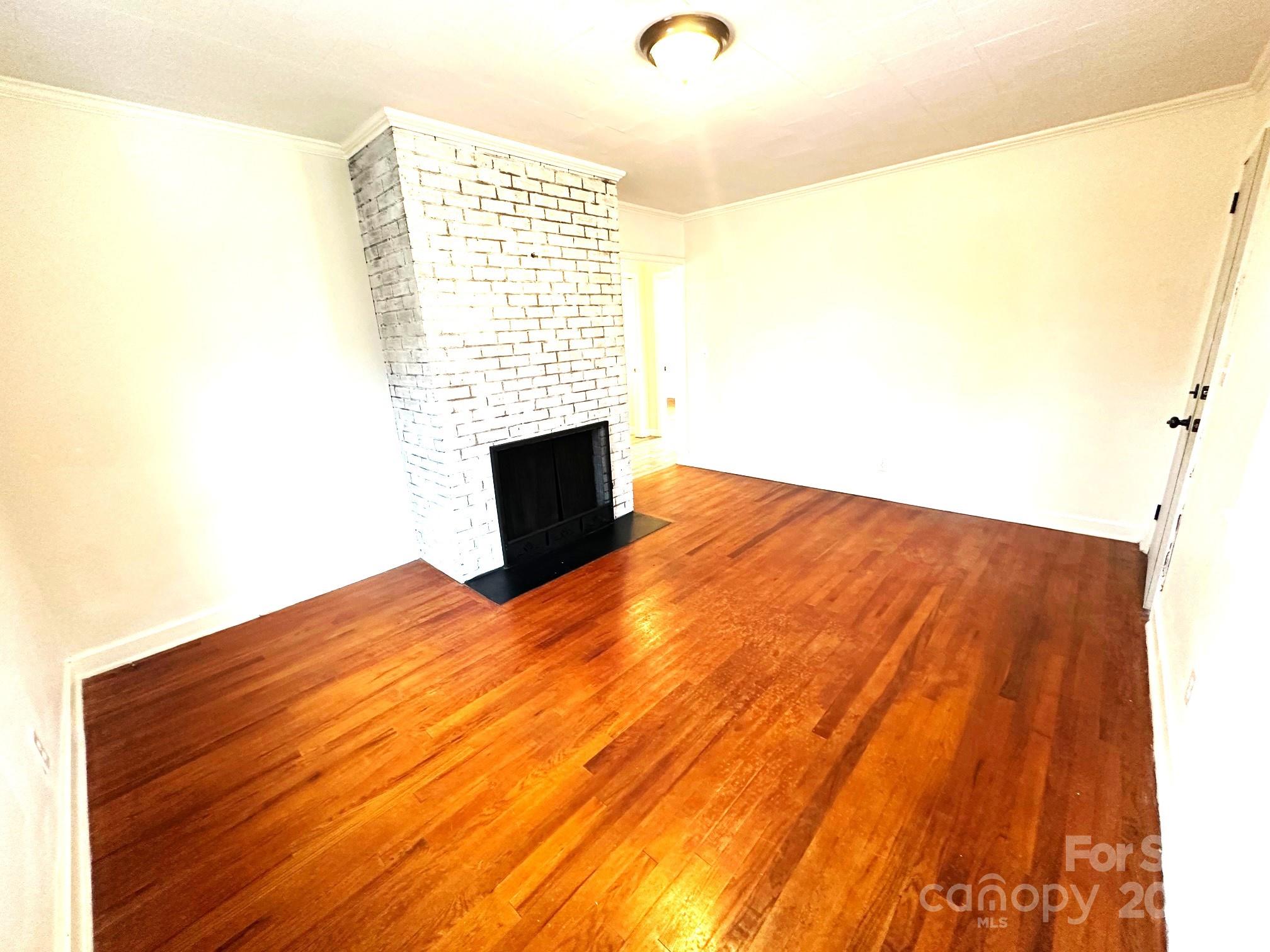 170 Proctor School Road Mooresboro, NC 28114 - Photo 12 of 32 a view of empty room with wooden floor