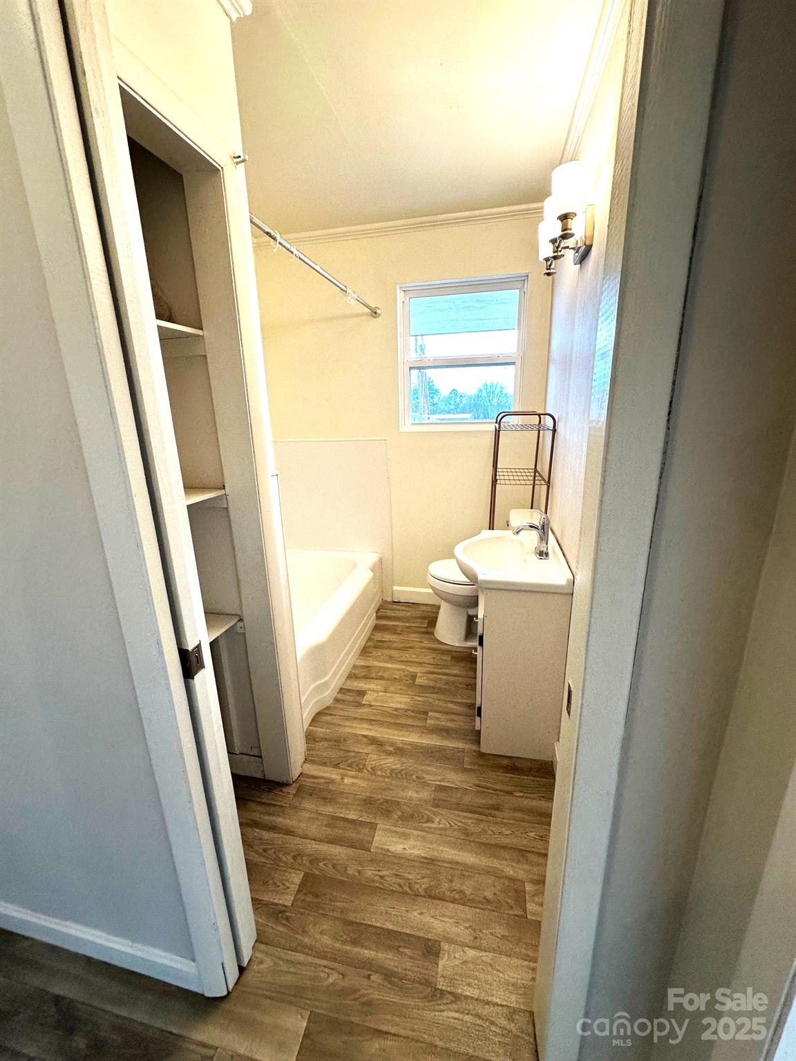 170 Proctor School Road Mooresboro, NC 28114 - Photo 24 of 32 a bathroom with a sink a toilet a shower and a window