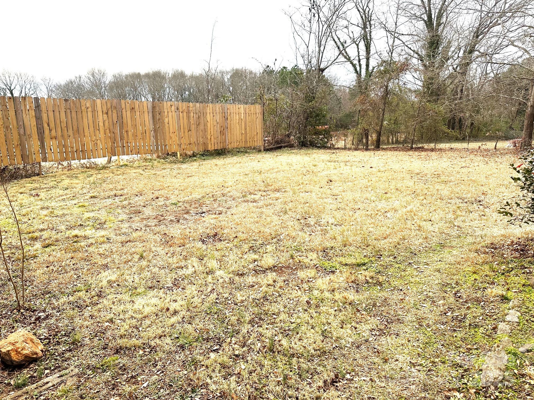 170 Proctor School Road Mooresboro, NC 28114 - Photo 27 of 32 a view of a yard with wooden fence