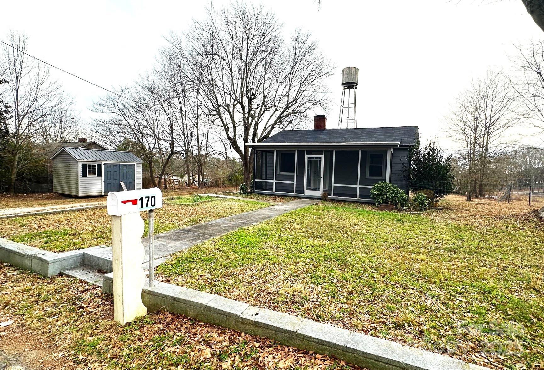170 Proctor School Road Mooresboro, NC 28114 - Photo 5 of 32 a front view of a house with a yard