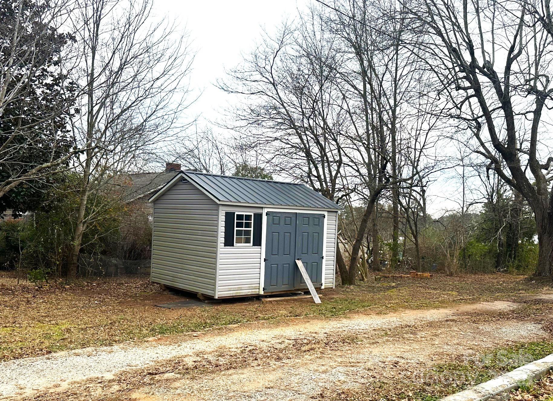 170 Proctor School Road Mooresboro, NC 28114 - Photo 9 of 32 a view of a house with a yard covered in snow