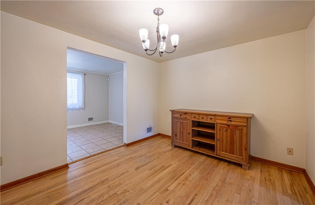 103 Cherry Valley Road Pittsburgh, PA 15221 - Photo 5 of 29 wooden floor in an empty room with a window