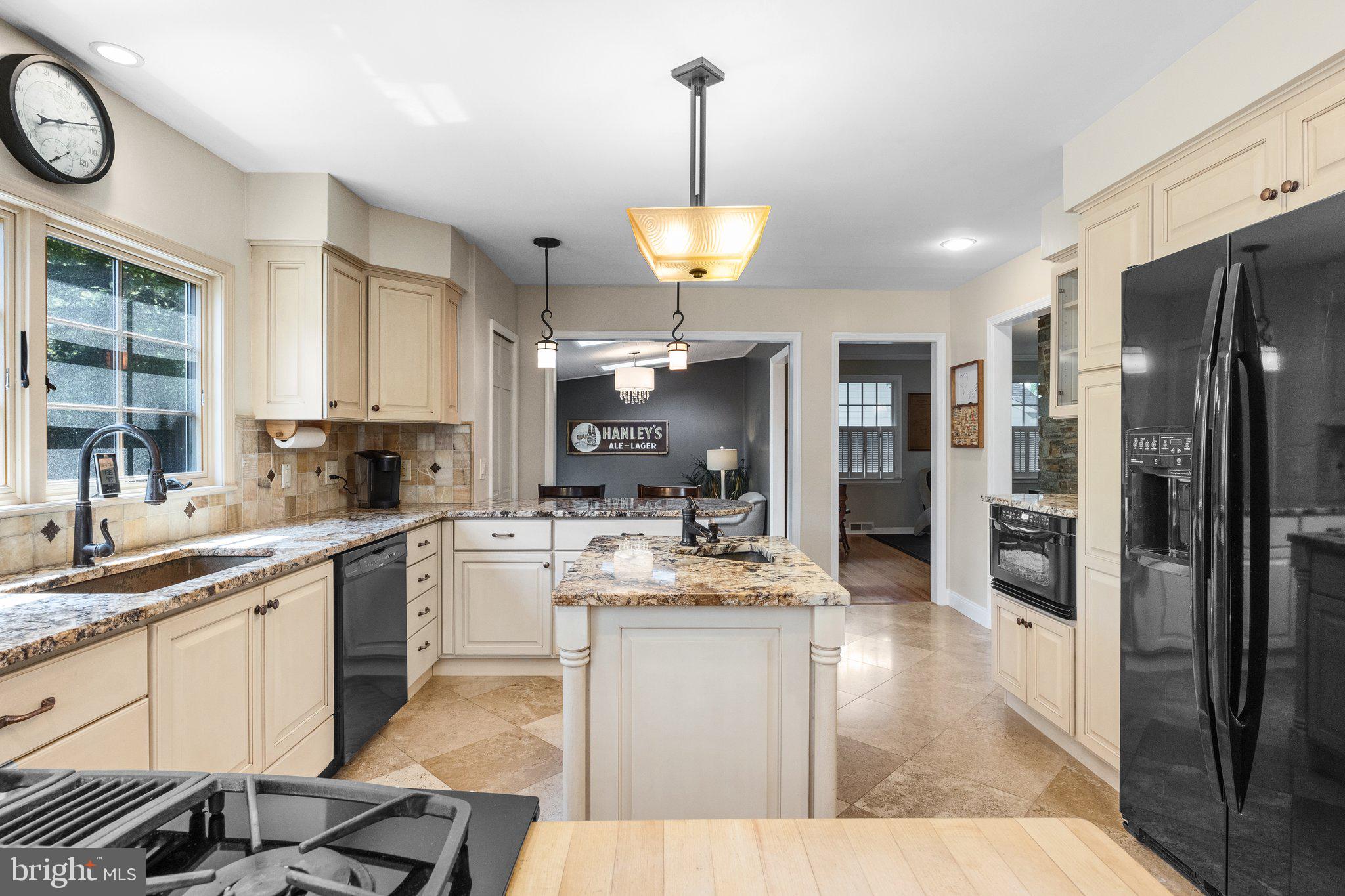 1313 Moon Drive Yardley, PA 19067 - Photo 16 of 56 a large kitchen with stainless steel appliances kitchen island granite countertop a sink and cabinets