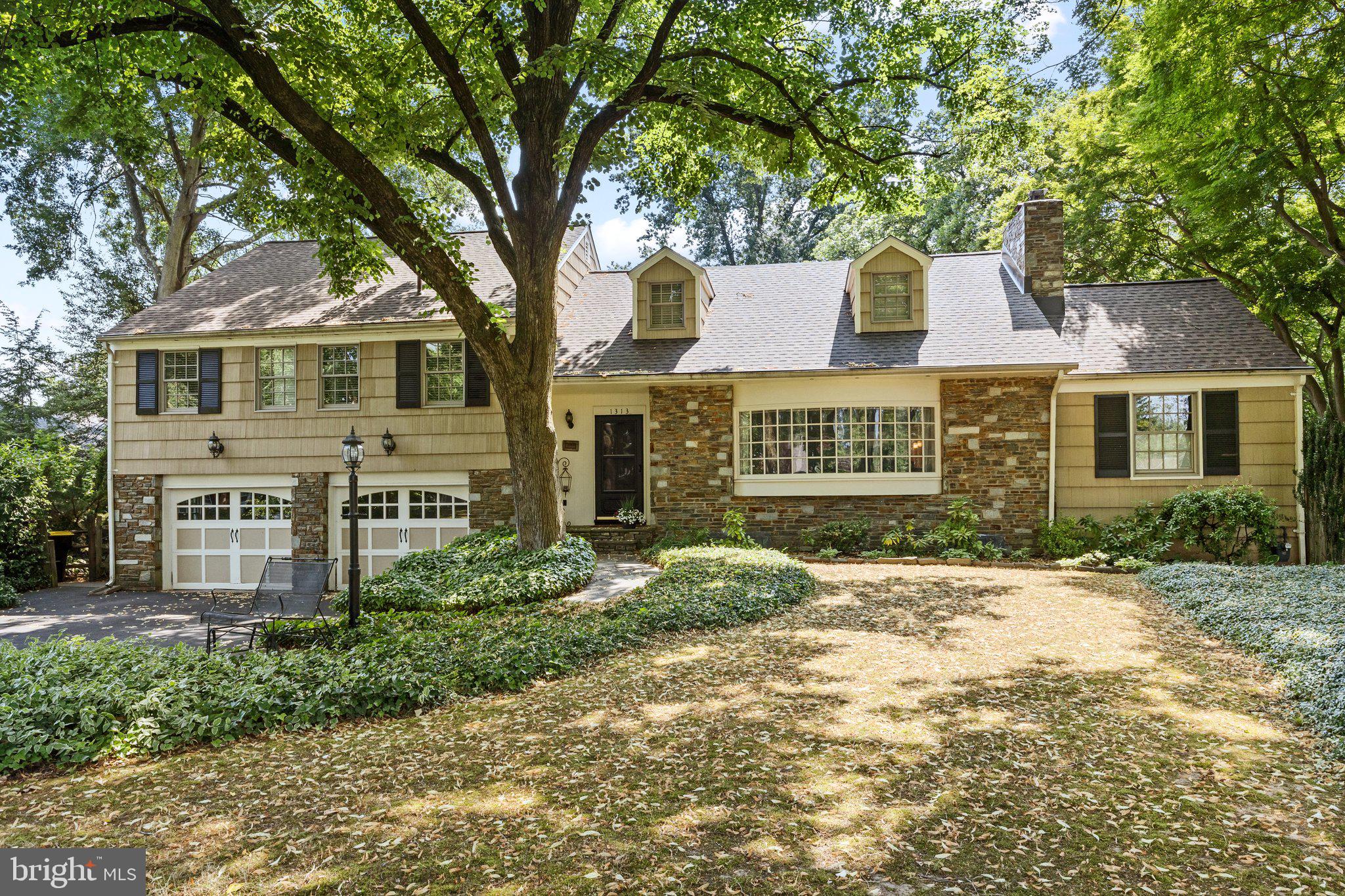 1313 Moon Drive Yardley, PA 19067 - Photo 2 of 56 a front view of a house with a garden