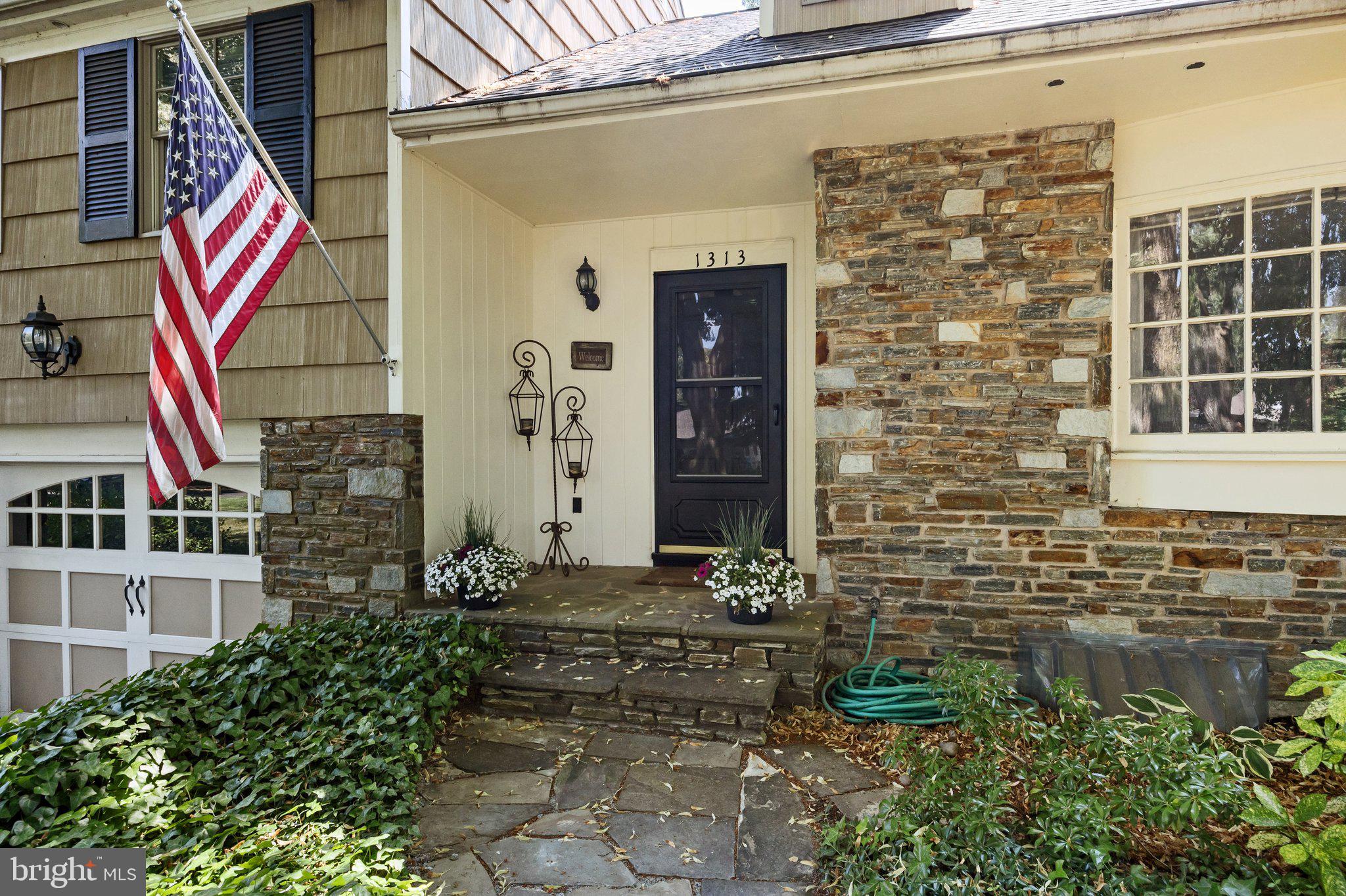 1313 Moon Drive Yardley, PA 19067 - Photo 3 of 56 a front view of a house with a yard