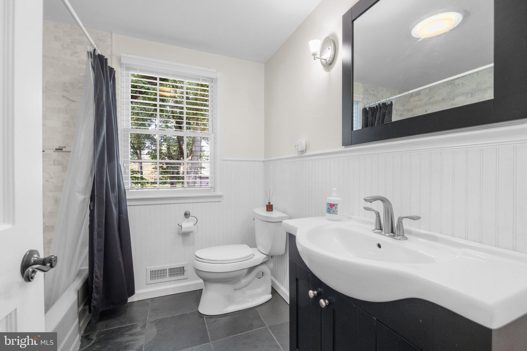 1313 Moon Drive Yardley, PA 19067 - Photo 38 of 56 a bathroom with a sink toilet and a mirror