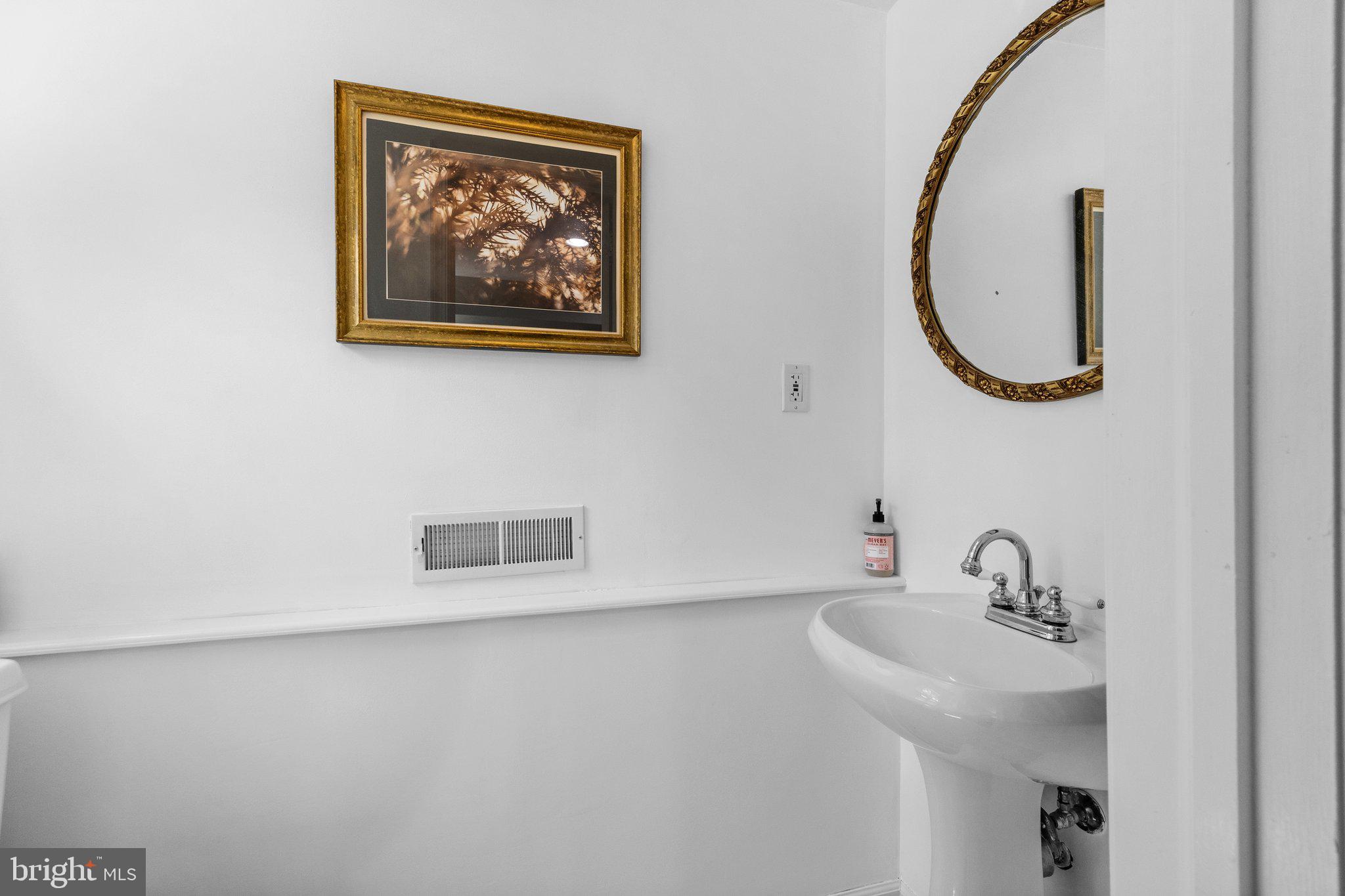 1313 Moon Drive Yardley, PA 19067 - Photo 42 of 56 a bathroom with a sink and a mirror