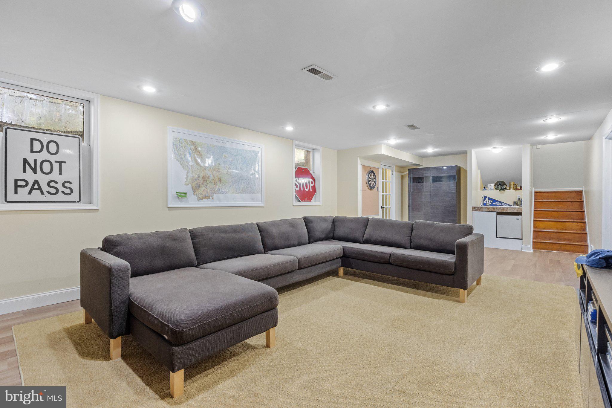 1313 Moon Drive Yardley, PA 19067 - Photo 43 of 56 a living room with furniture and a wall painting