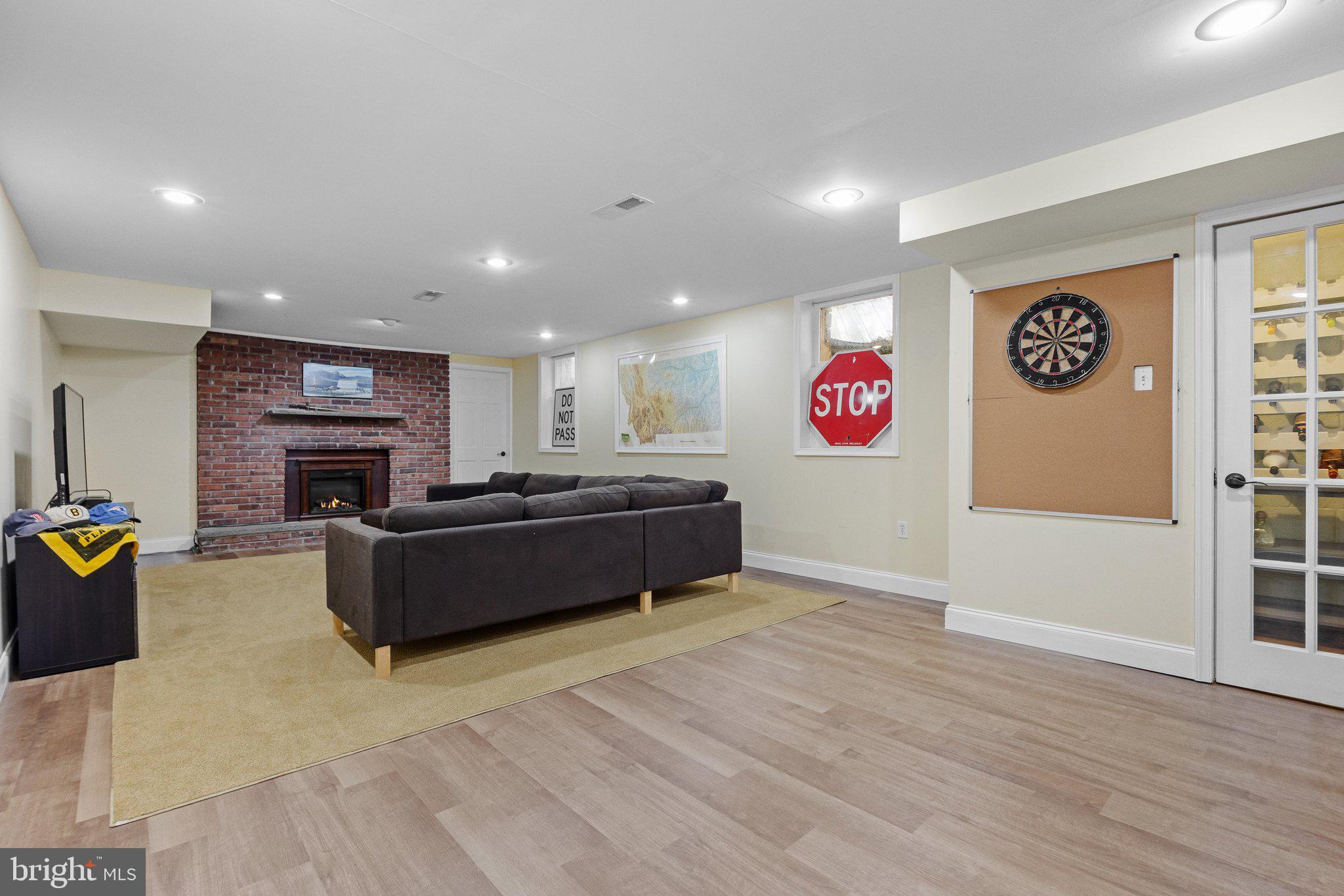 1313 Moon Drive Yardley, PA 19067 - Photo 45 of 56 a living room with fireplace furniture and a wooden floor