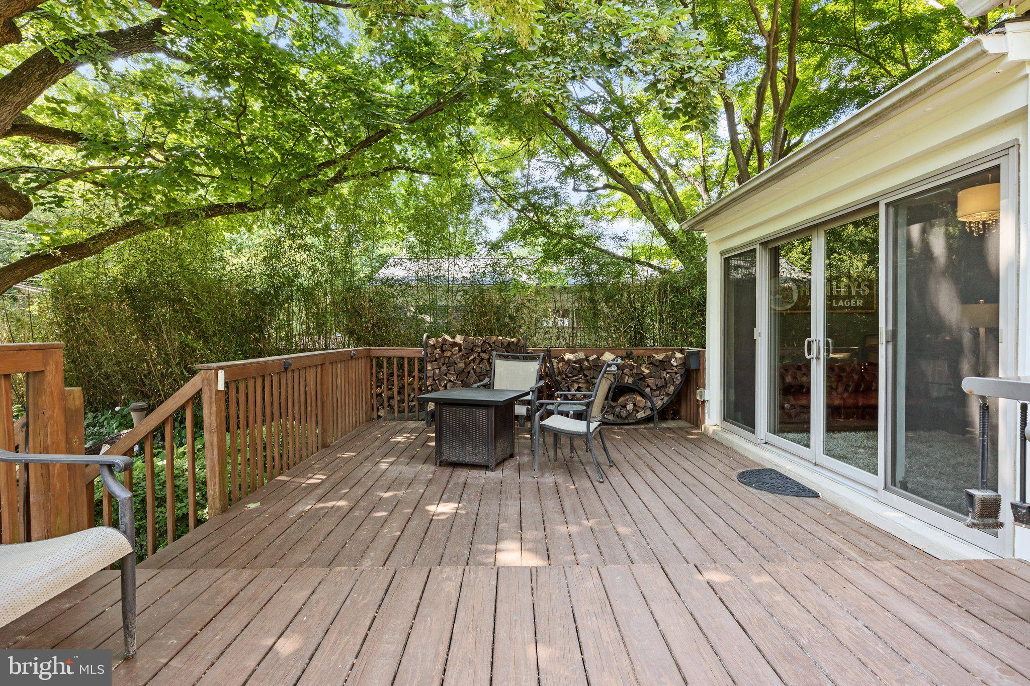 1313 Moon Drive Yardley, PA 19067 - Photo 48 of 56 a view of a deck with table and chairs and wooden floor