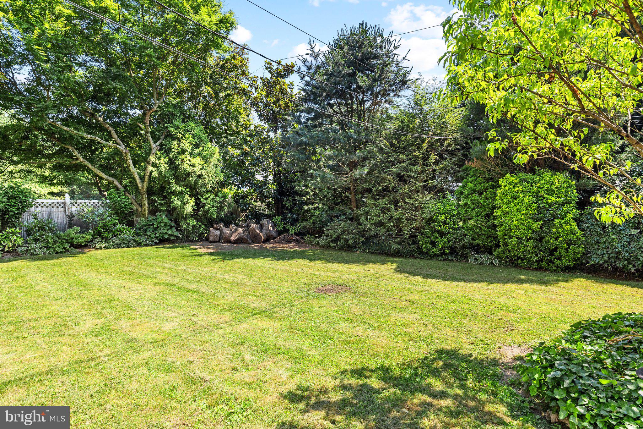 1313 Moon Drive Yardley, PA 19067 - Photo 51 of 56 a view of a large yard with an trees