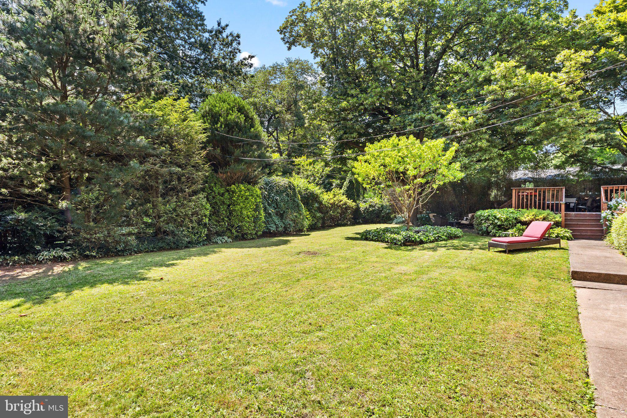 1313 Moon Drive Yardley, PA 19067 - Photo 52 of 56 a view of a swimming pool and trees in the background