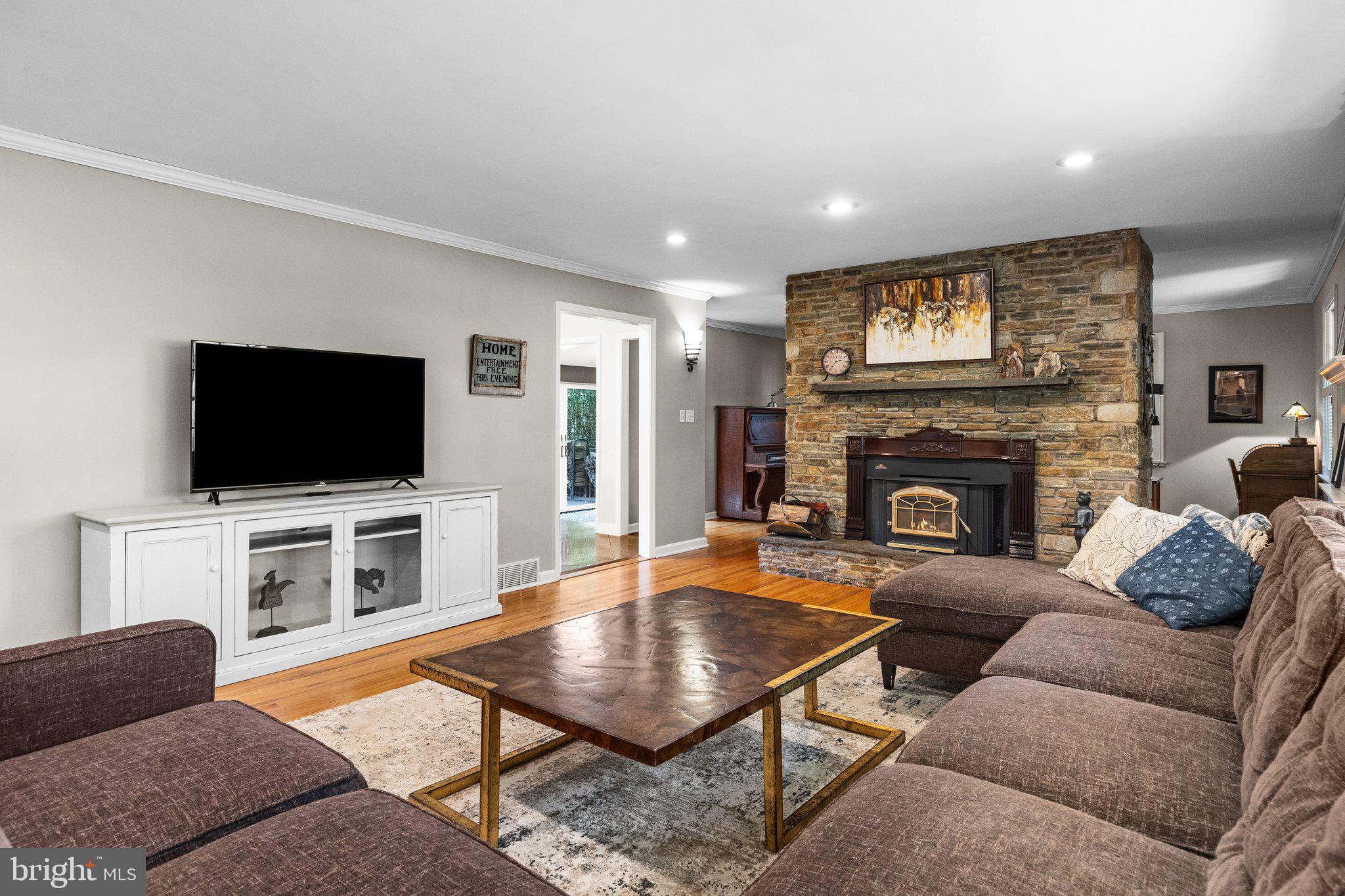 1313 Moon Drive Yardley, PA 19067 - Photo 8 of 56 a living room with furniture and a flat screen tv