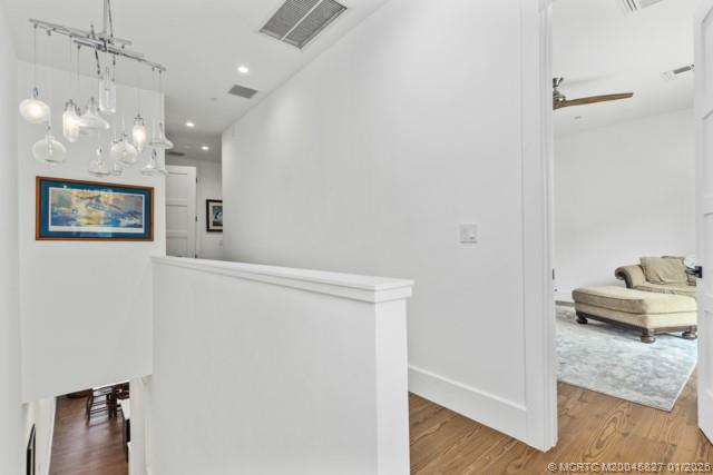 53 Southeast Seminole Street, Unit 2B Stuart, FL 34994 - Photo 17 of 31 a view of a hallway with workspace
