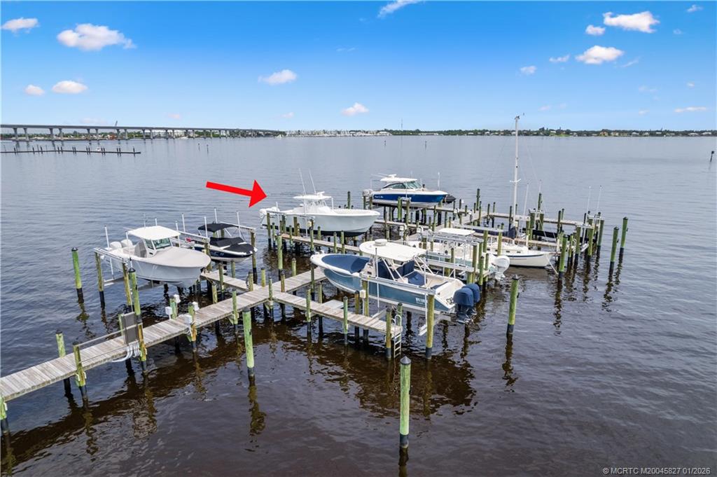 53 Southeast Seminole Street, Unit 2B Stuart, FL 34994 - Photo 6 of 31 a roof deck with table and chairs
