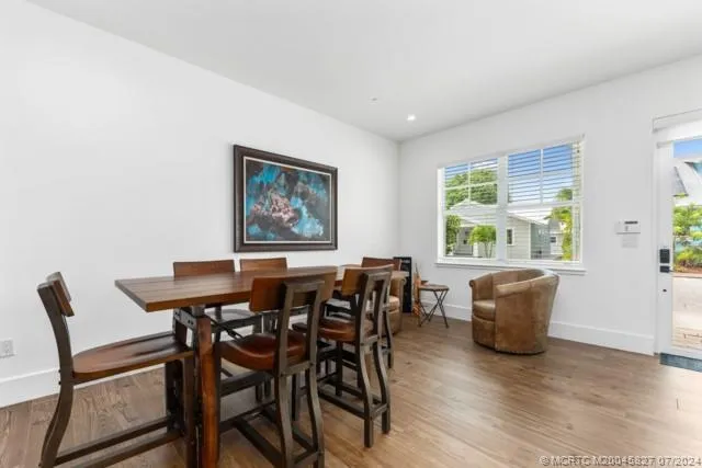 a kitchen with stainless steel appliances a sink stove and refrigerator