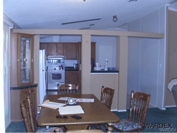4390 North Shadow Road Kingman, AZ 86409 - Photo 22 of 36 dining room to kitchen