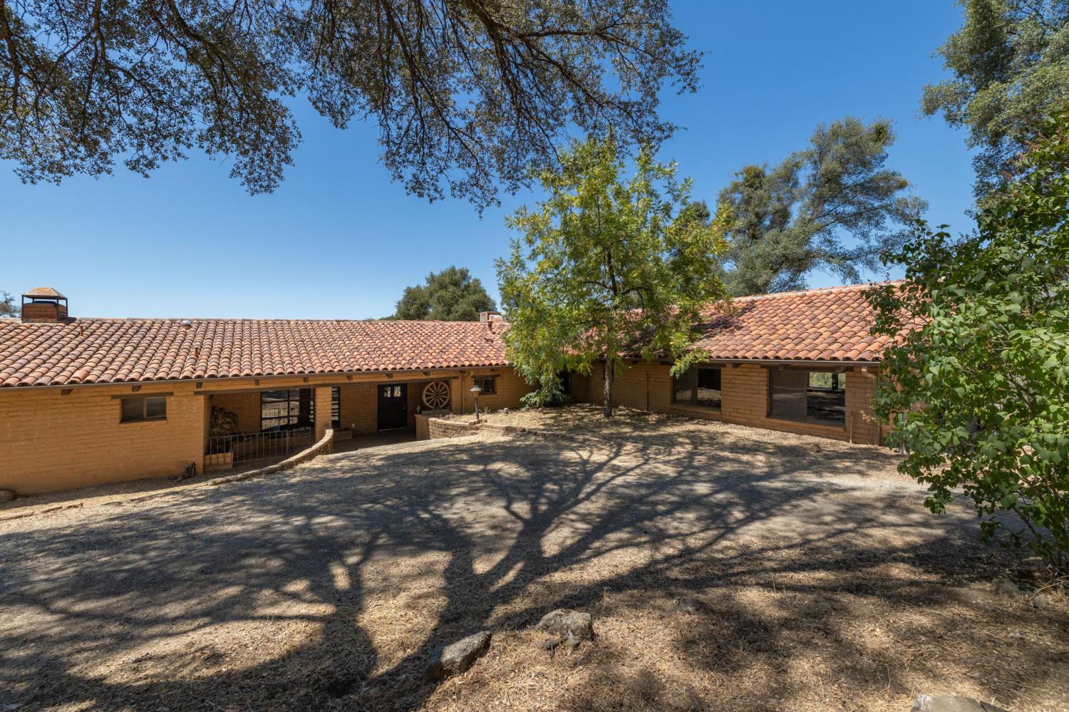 3981 Snow Creek Road Mariposa, CA 95338 - Photo 11 of 66 a view of a house with a patio